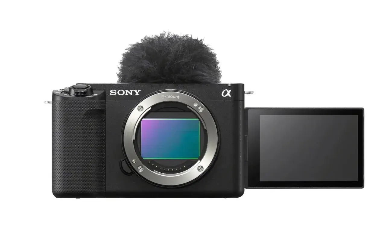 Aparat Sony Alpha z mikrofonem na gorącej stopce i odchylanym ekranem. Idealny do vlogowania, ten model zve1 to Twój nowy kompan twórczy.